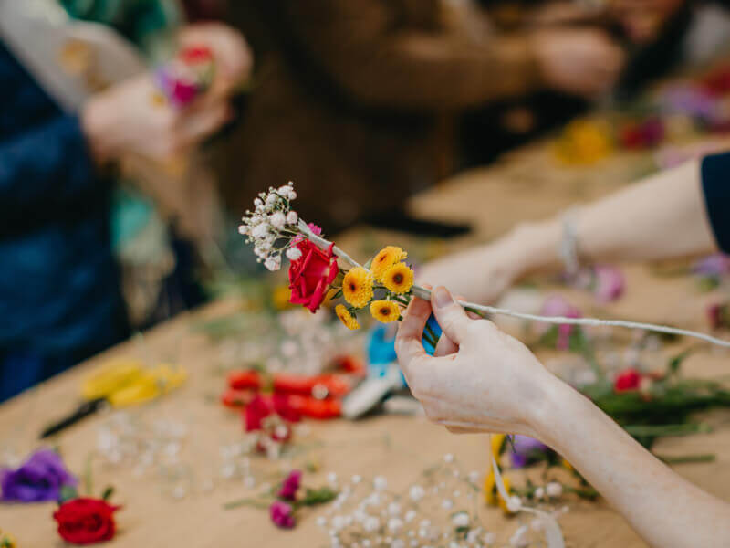 A close up of some colourful flowers someone is using in a floral design.